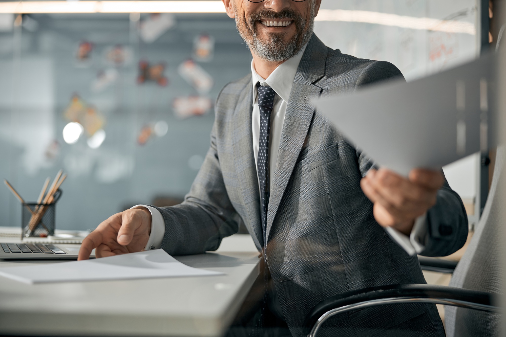 Smiling man hand over document at office